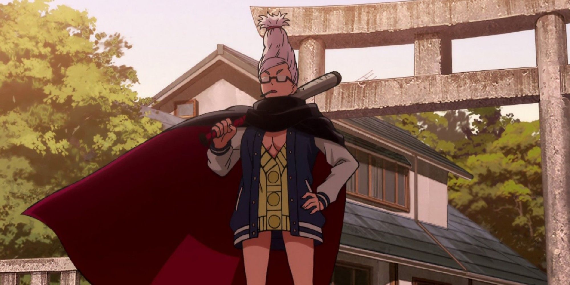 Grandma Seiko wears a cape and holds a baseball bat on her shoulder