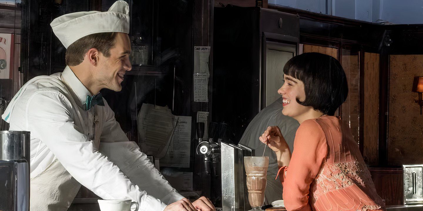 Haley Lu Richardson as Louise laughing at a diner counter in The Chaperone