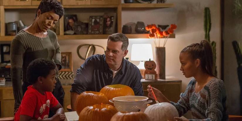 Harry Grant (Marcanthonee Reis) carving pumpkins with his family in 9-1-1.
