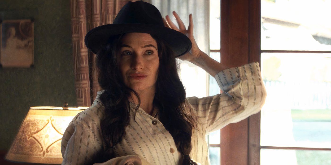 Kathryn Hahn as Agatha Harkness putting on a hat in Agatha All Along