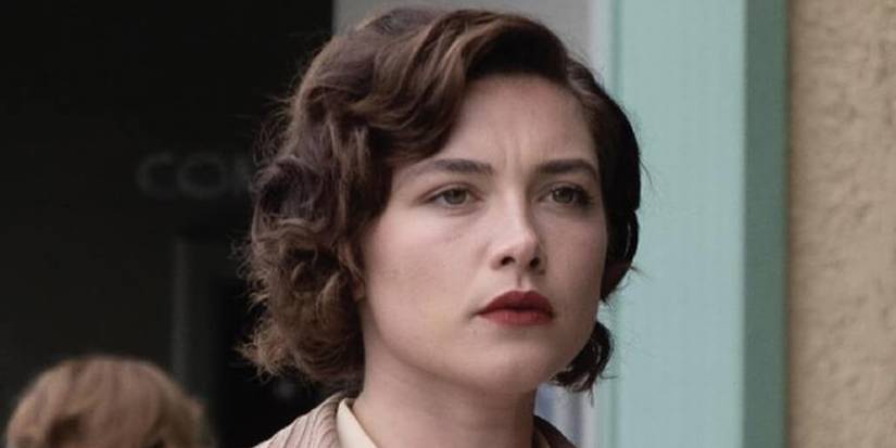 Jean Tatlock (Florence Pugh) looking at something in Oppenheimer.