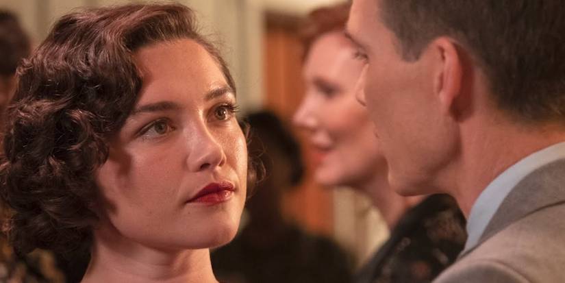 Jean Tatlock (Florence Pugh) staring at Robert Oppenheimer (Cillian Murphy) in Oppenheimer.