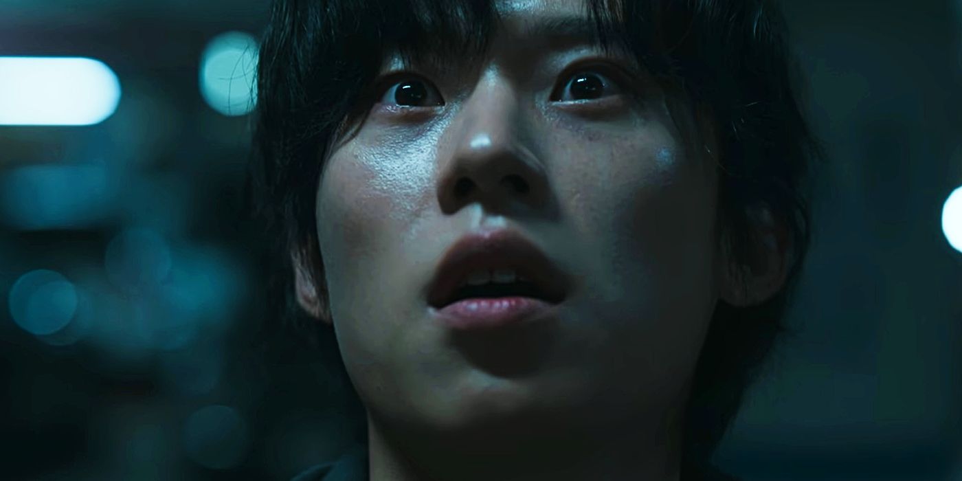 Jin-su looks up with fear in his eyes. 