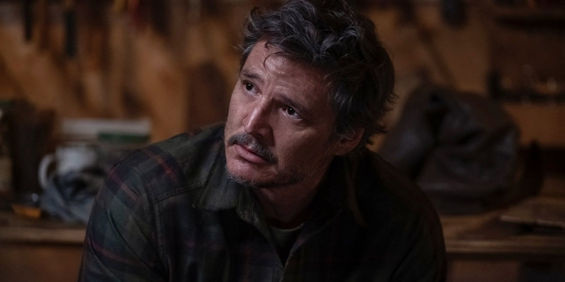 Joel (Pedro Pascal) looking sad in The Last of Us