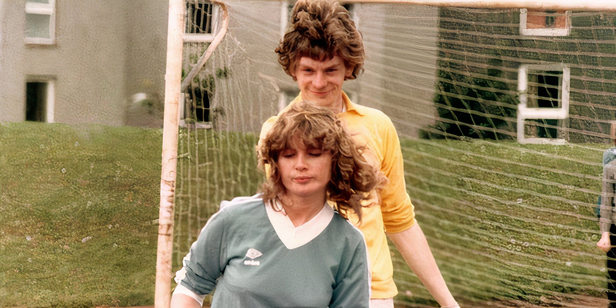 John Gordon Sinclair smiles as Dee Hepburn walks past him. 