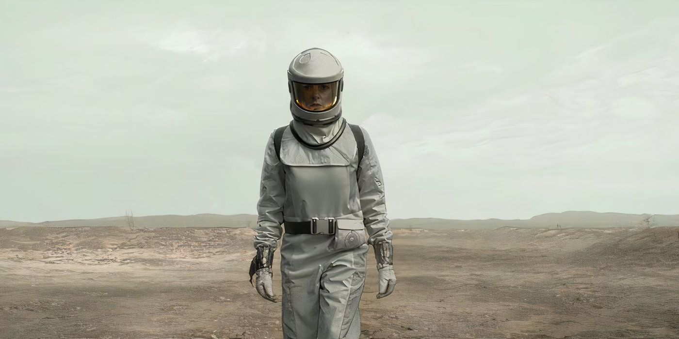 Juliette walks through a dusty field outside the silo in Silo season 2