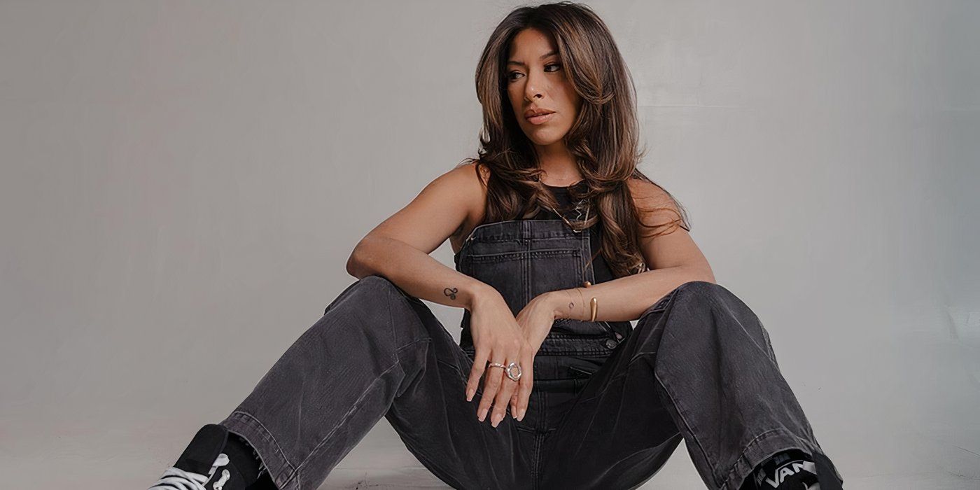 Married At First Sight season 18 Karla Juarez seated on the floor wearing a grey dungaree