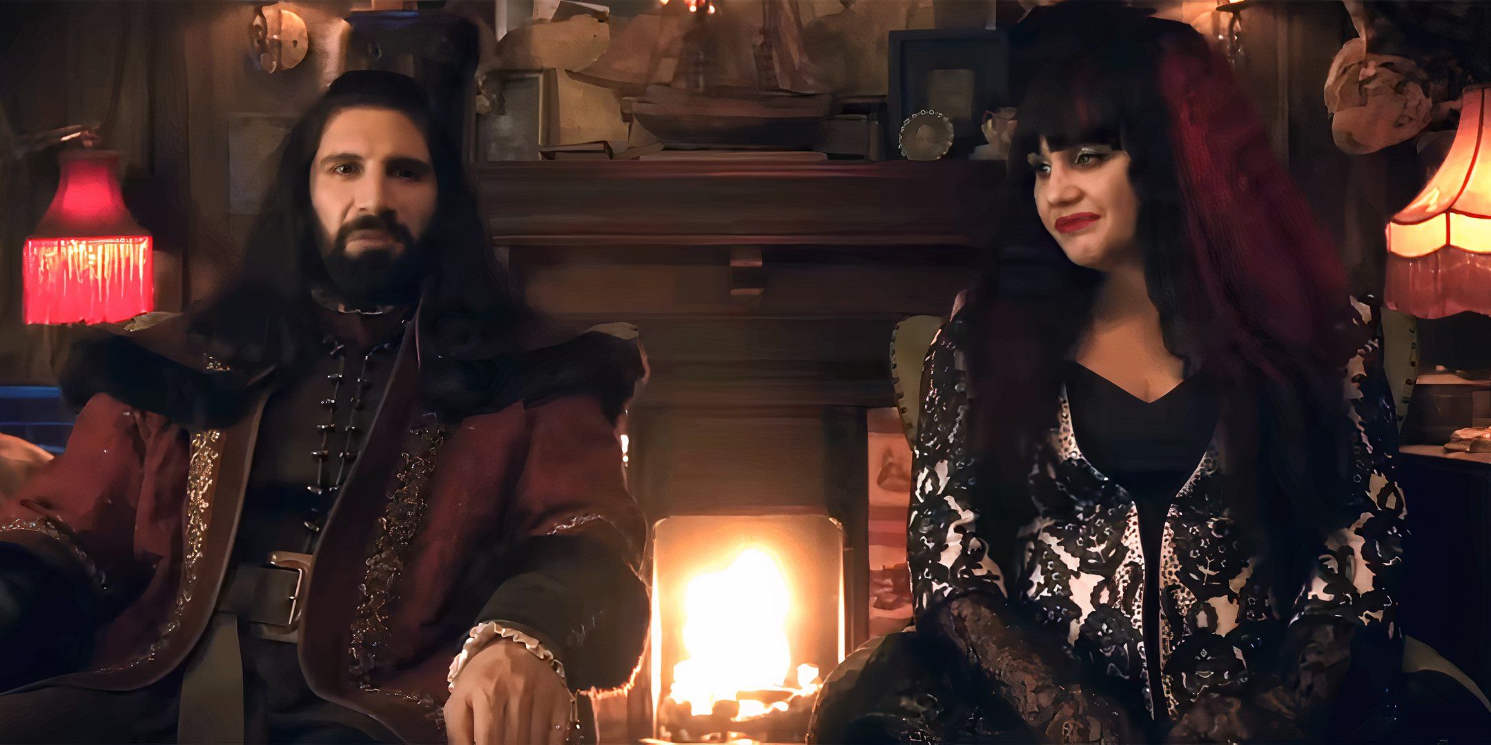 Kayvan Novak's Nandor and Natasia Demetriou's Nadja sitting next to each other and talking to the camera in What We Do in the Shadows season 6