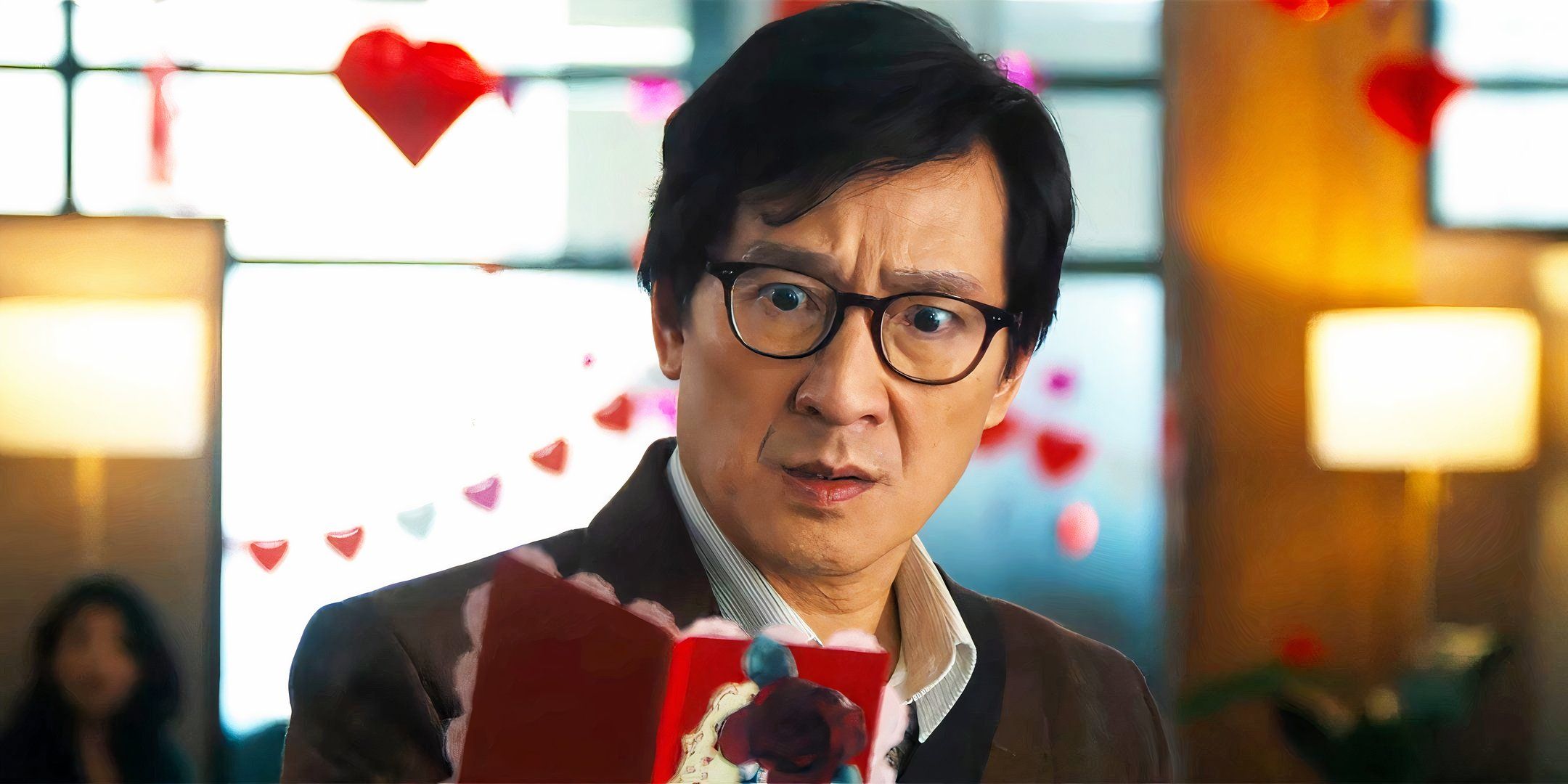 Ke Huy Quan as Marvin looking worried while reading a Valentine's Day card in Love Hurts-1