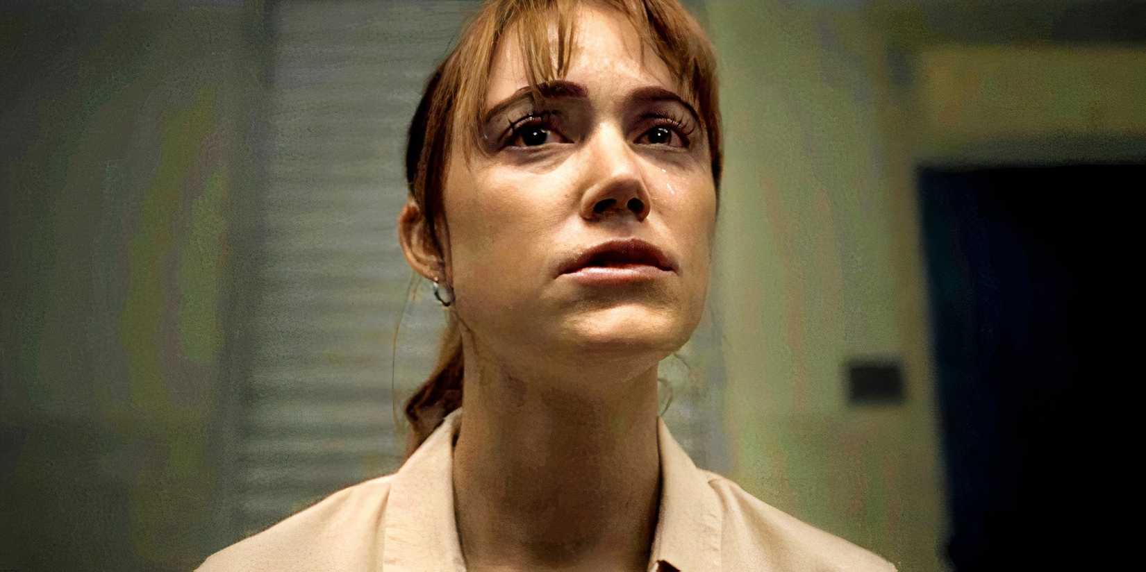 Maika Monroe is upset while in a room in Longlegs