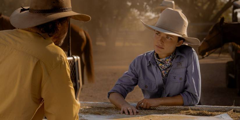 Susie looks toward her father in Territory