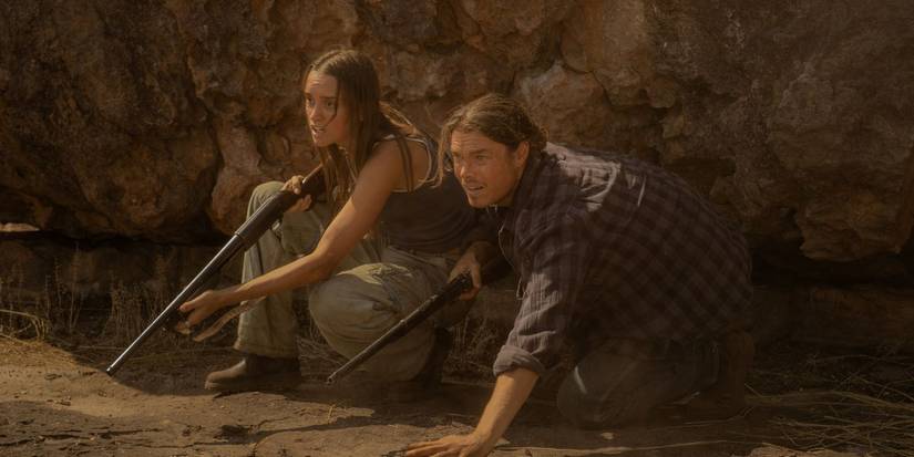 Two characters ducking with guns in Territory