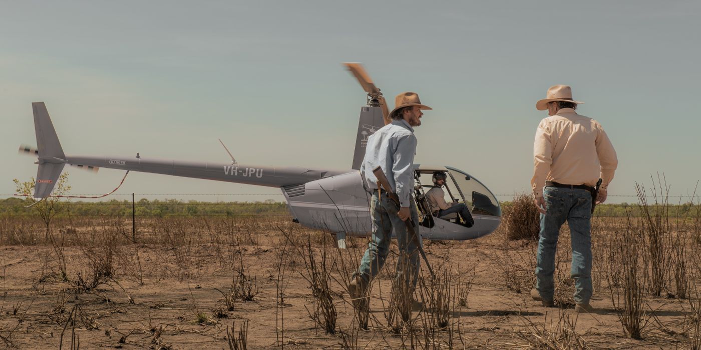 Characters in front of a helicopter in Territory