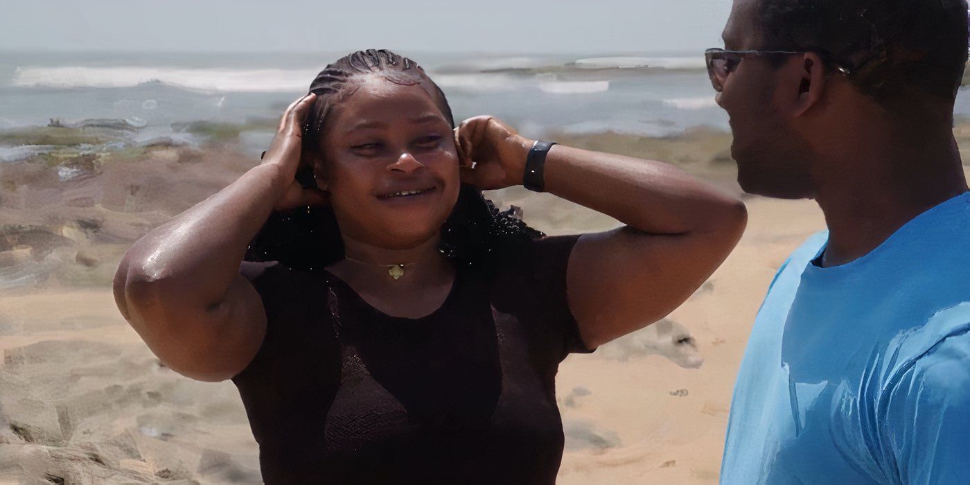 Matilda Nti in 90 Day Fiance holding her head at beach with Niles