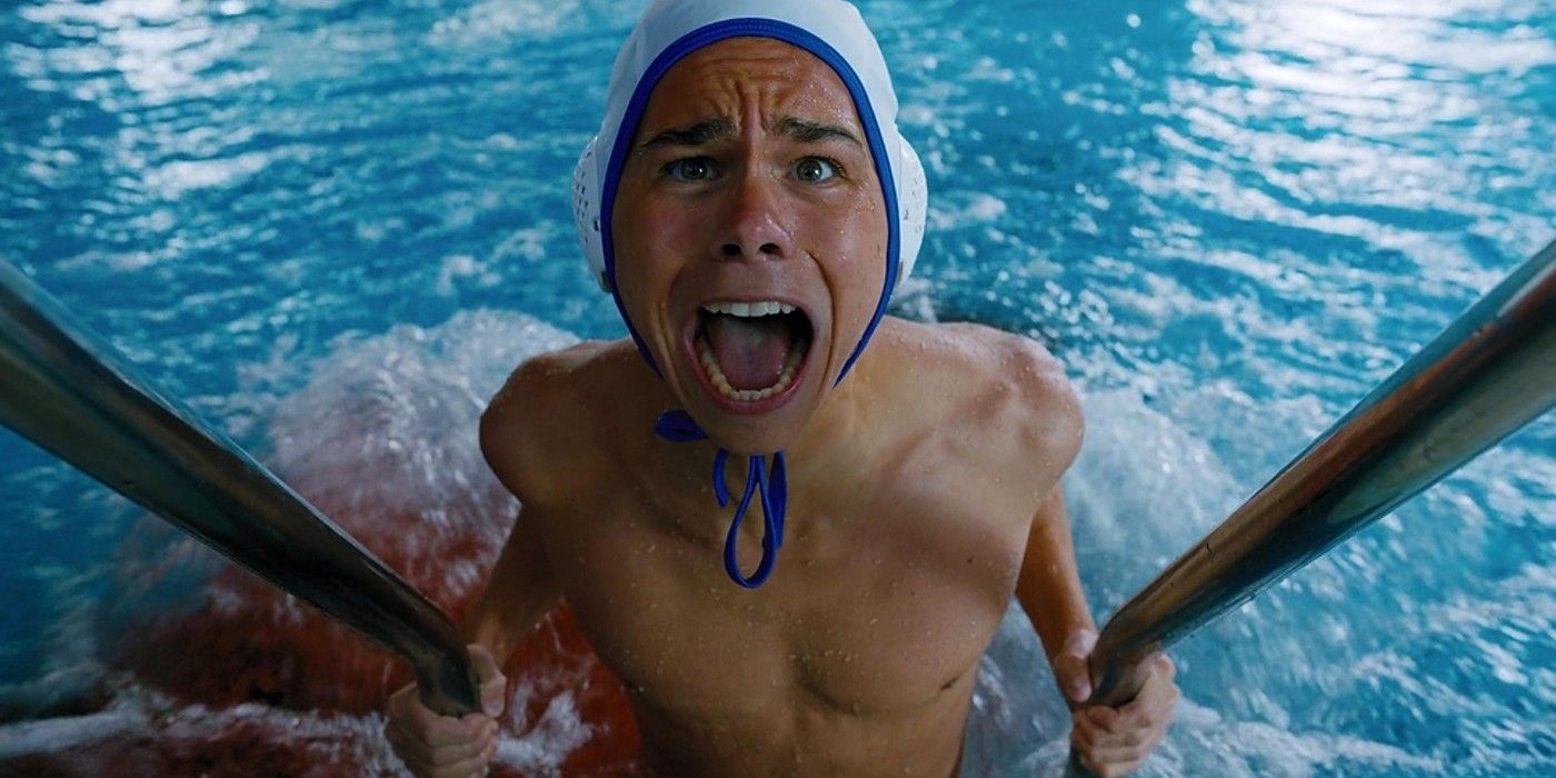 Max Pemberton as Dalton screaming in a pool as piranhas attack him in Wednesday season 1