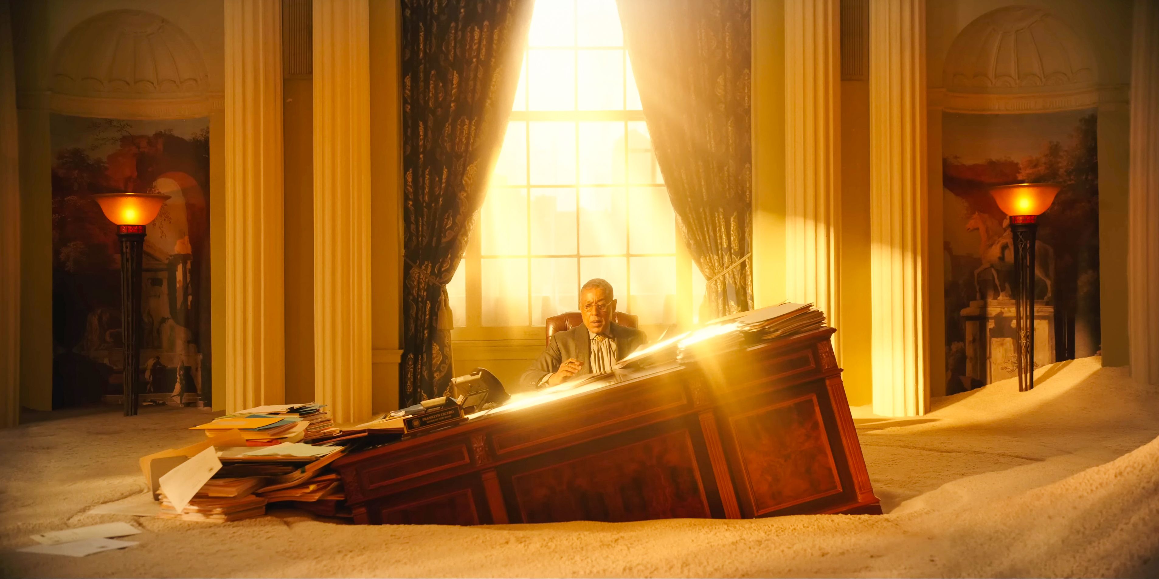 Mayor Cicero's (Giancarlo Esposito) desk sinking into sand in Megalopolis