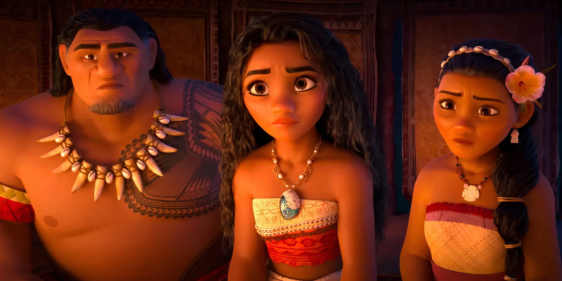 Moana parece triste mientras se sienta junto a dos personas en Moana 2