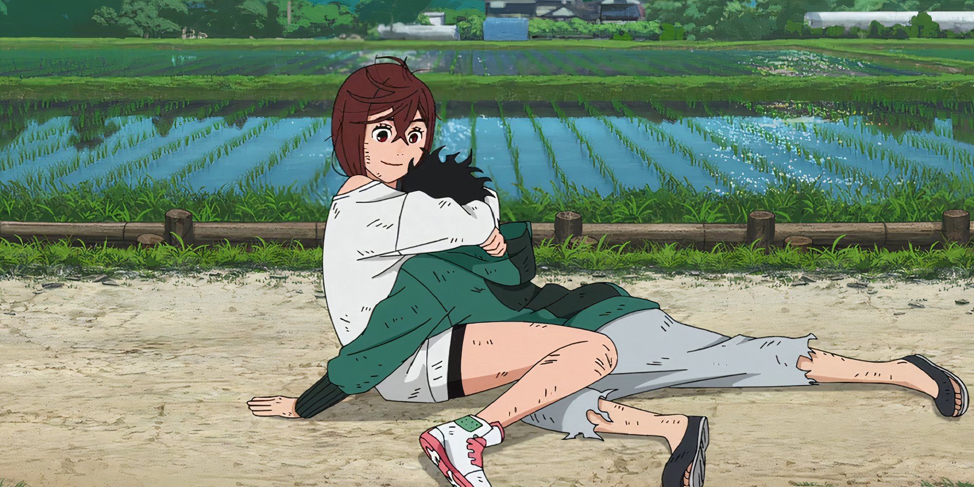 Momo holds Okarun's head on her chest