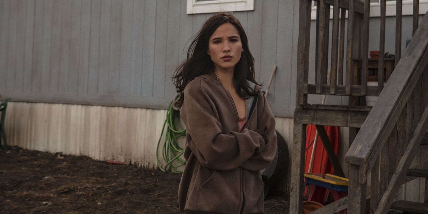 Monica (Kelsey Asbile) looking frightened outside her house in Yellowstone.