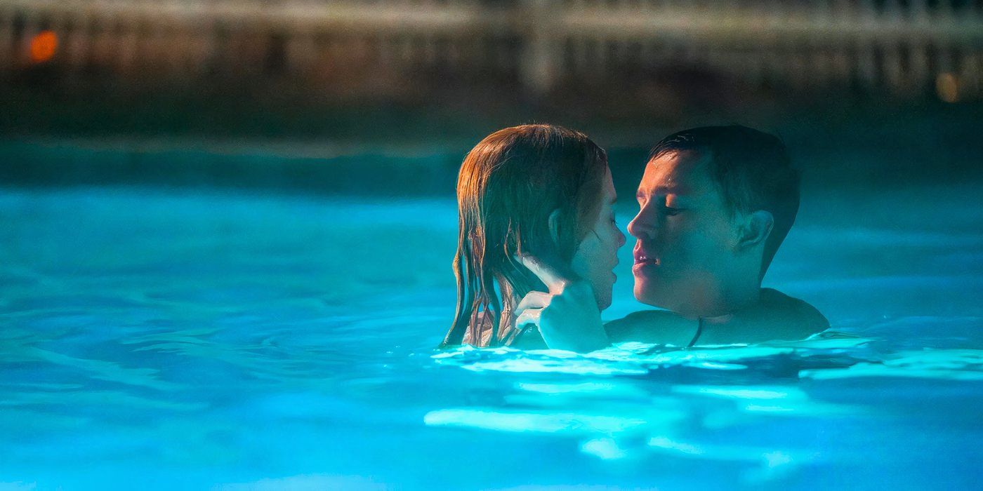 Nicole Kidman and Harris Dickinson about to kiss in a swimming pool in Babygirl