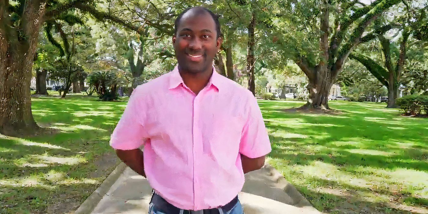 Niles Valentine in 90 Day Fiance in pink shirt standing inside park