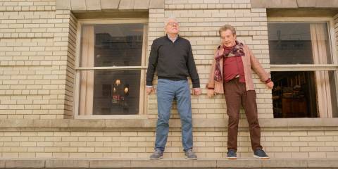 Charles (Steve Martin) and Oliver (Martin Short) walking along the building's ledge in Only Murders in the Building Season 4 Ep 10