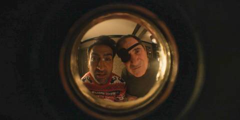 Rudy Thurber (Kumail Nanjiani) and Vince Fish (Richard Kind) seen through the door peephole in Only Murders in the Building Season 4 Ep 10