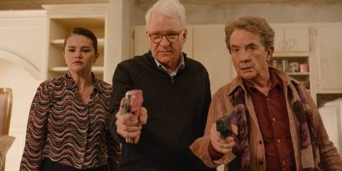 Mabel (Selena Gomez), Charles (Steve Martin), and Oliver (Martin Short) pointing weapons at Marshall P. Pope in Only Murders in the Building Season 4 Ep 10