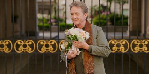 Oliver (Martin Short) holding a bouquet of flowers in Only Murders in the Building Season 4 Ep 10