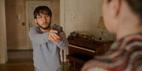 Marshall P. Pope (Jin Ha) wielding a gun in Only Murders in the Building Season 4 Ep 10