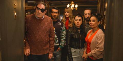 The Westies look outside a door, thankful that their secret about Dudenoff is not revealed in Only Murders in the Building Season 4 Episode 8