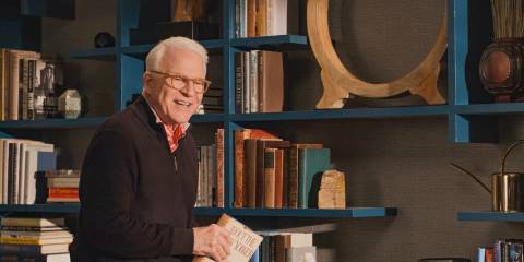 Charles (Steve Martin) rearranging the film set that represents his apartment in Only Murders in the Building Season 4 Episode 8