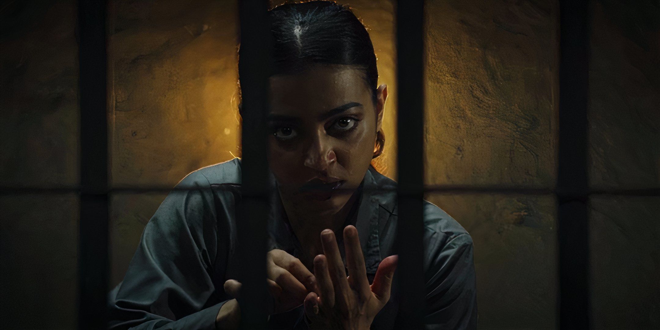 Radhika Apte looks through prison bars with an unsettling stare. 