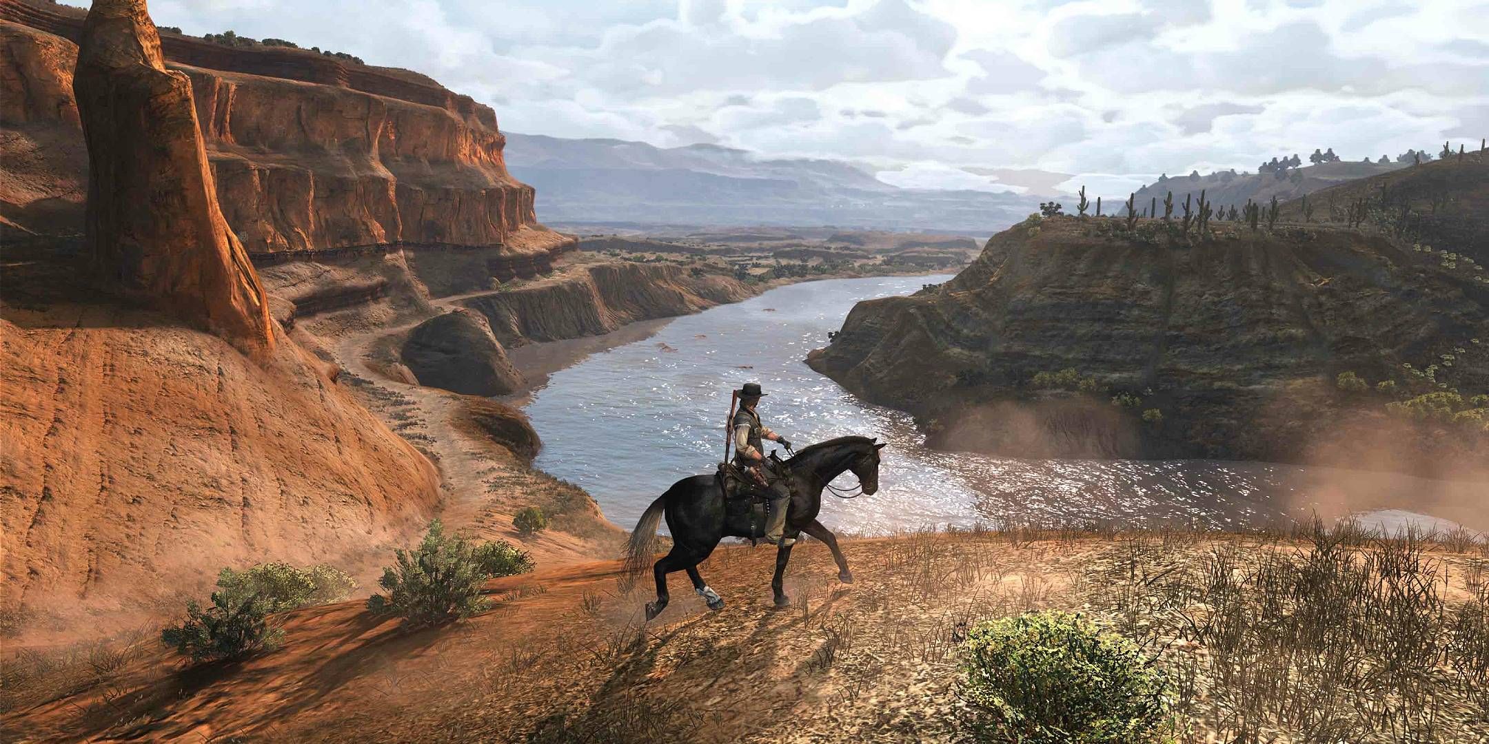 John Marston crosses a vast river on horseback in Red Dead Redemption.