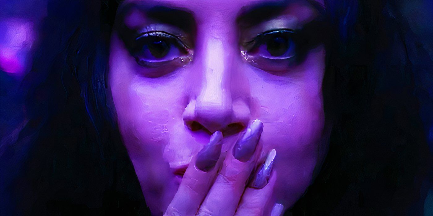 Rio Vidal blowing a kiss in purple light in Agatha All Along