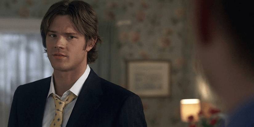 Jared Padalecki as Sam Winchester talking to someone off-screen in Supernatural.