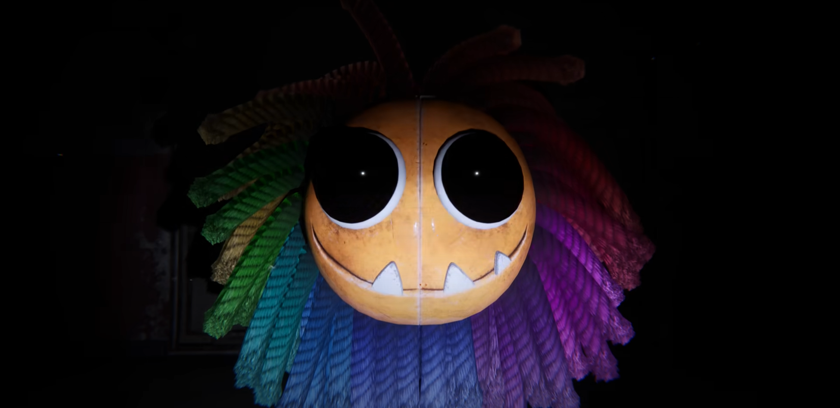 Poppy Playtime's Yarnaby face peeking out from the darkness