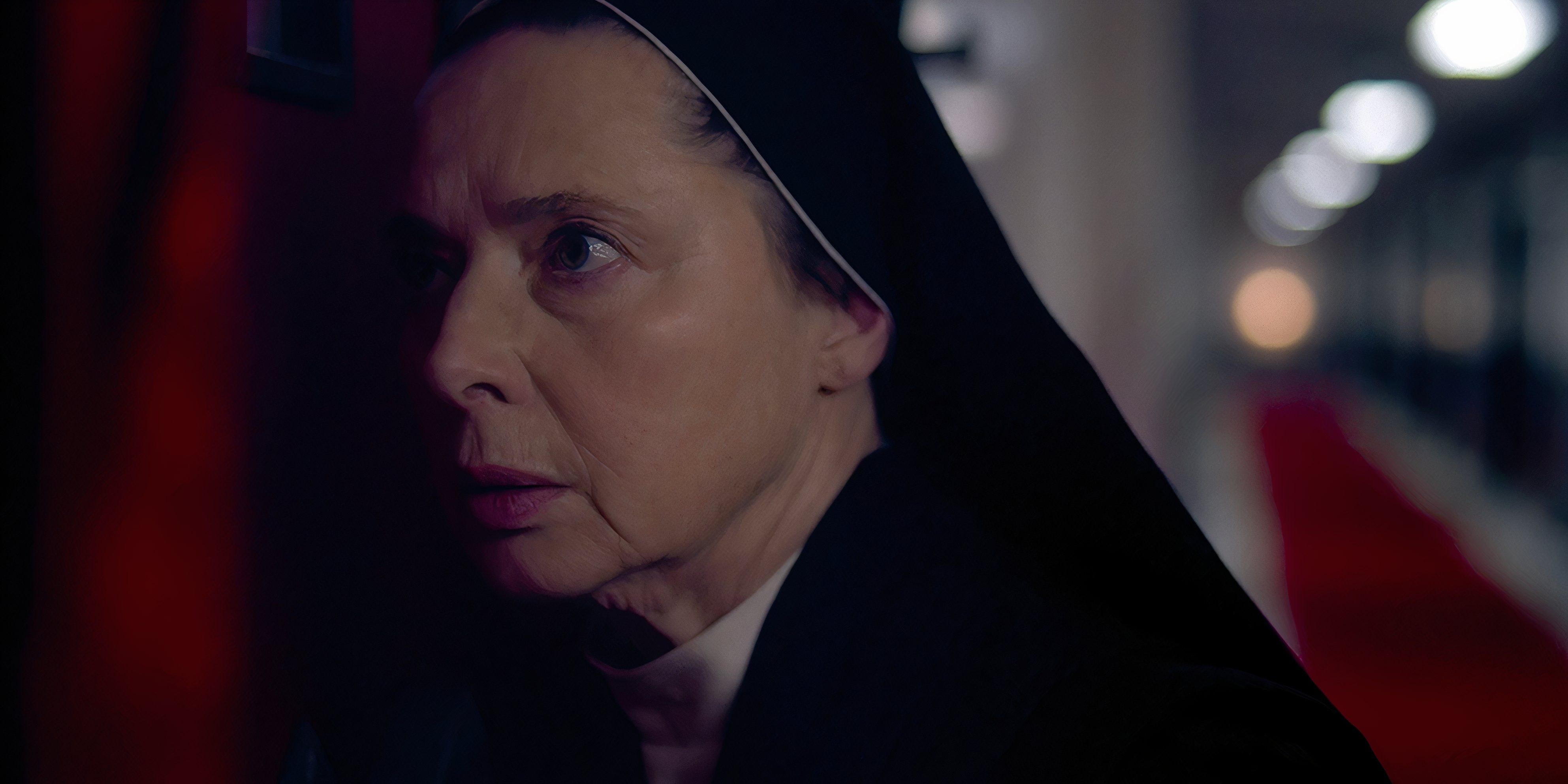 Sister Agnes looking serious in Conclave as she eavesdrops