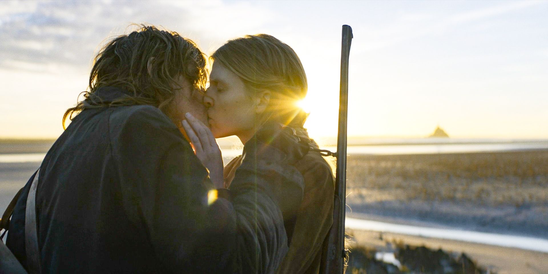 Daryl (Norman Reedus) and Isabelle (Clémence Poésy) kissing in The Walking Dead: Daryl Dixon Season 2 Episode 2