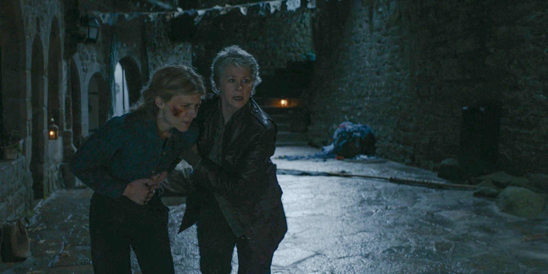 Carol (Melissa McBride) tries to help Isabelle (Clémence Poésy), who is injured in The Walking Dead: Daryl Dixon Season 2 Episode 4