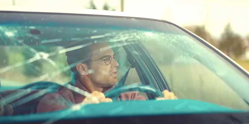 Theo James' Hal:Bill looks through his broken windshield at something in The Monkey trailer