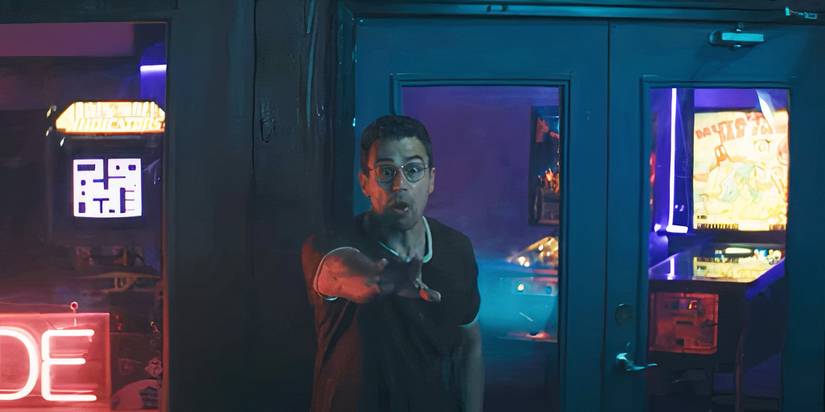 Theo James holding his hand out and yelling in The Monkey