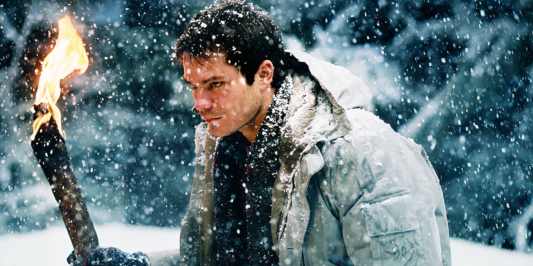 Timothy Olyphant as Pete looking angry and holding a torch while out in the snow in Dreamcatcher