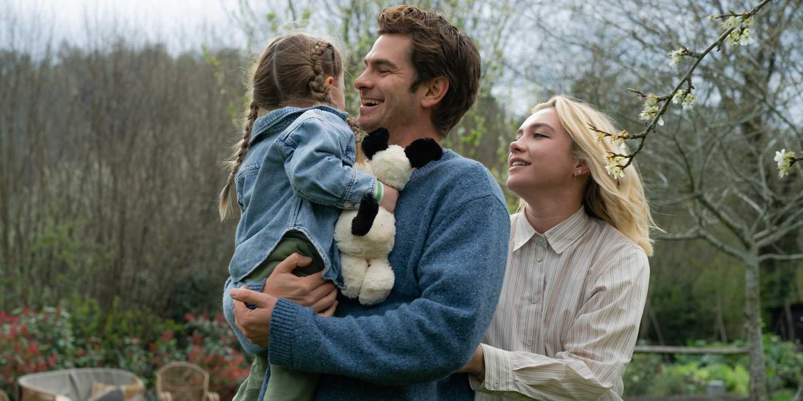 Tobias and Ella outside with their daughter in We Live in Time