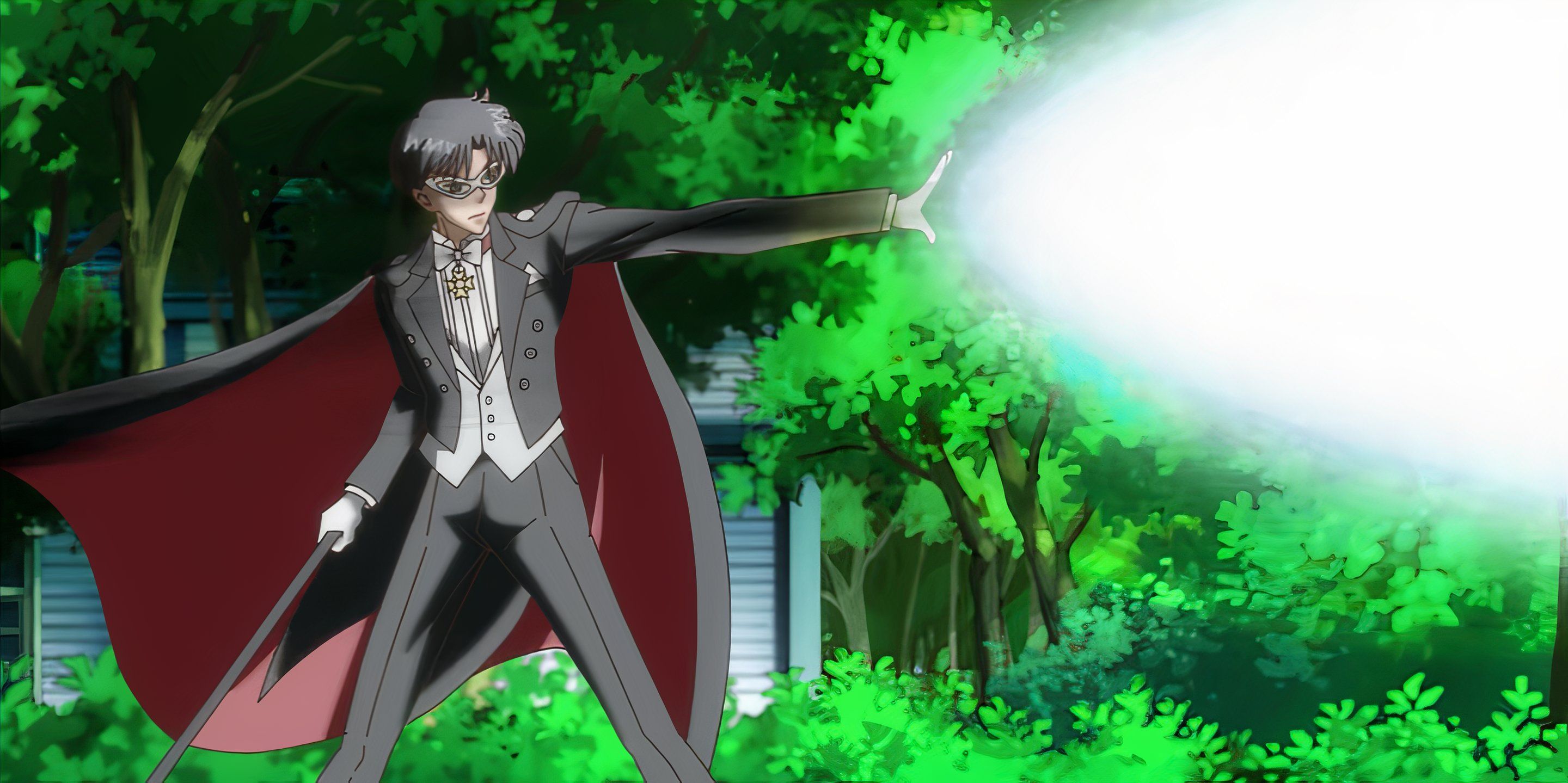 Tuxedo Mask unleashes his signature attack, a beam of white light erupting from his hand.