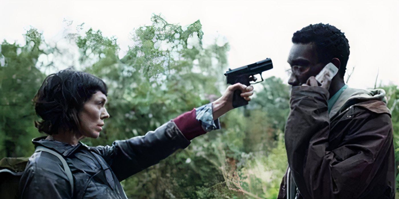 Fiona O'Shaughnessy as Jessica Hyde pointing a gun at Nathan Stewart-Jarrett as Ian Johnson, while he talks on the phone, in Utopia.