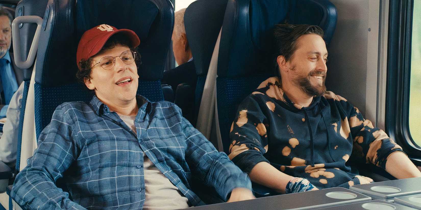 Jesse Eisenberg and Kieran Culkin sitting on a train in A Real Pain