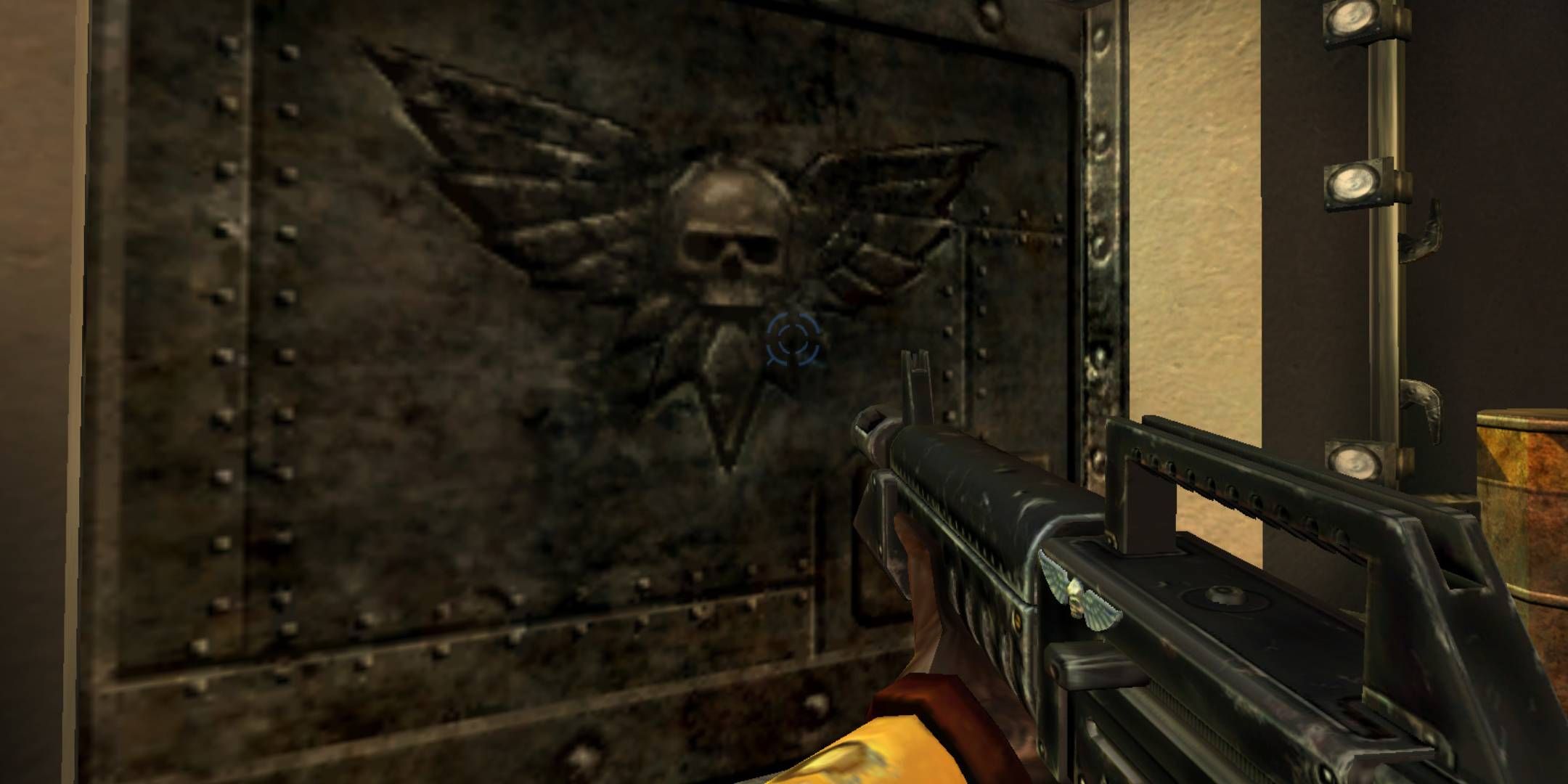 The player holding an Imperial rifle next to a giant metal gate with a skull on it in Warhammer 40,000 Tau Fire Warrior.