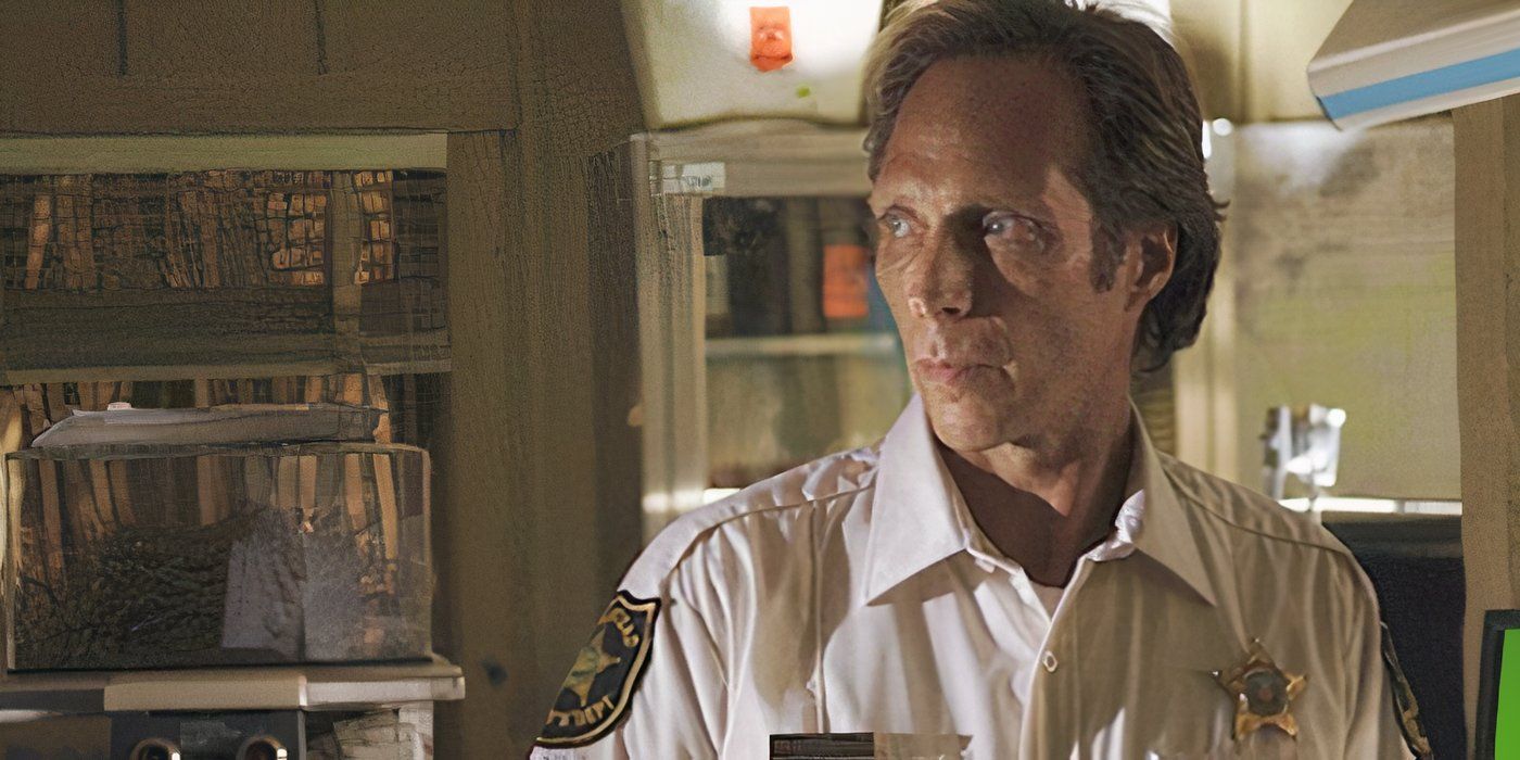 William Fichtner looks to the side with a worried expression on his face. 