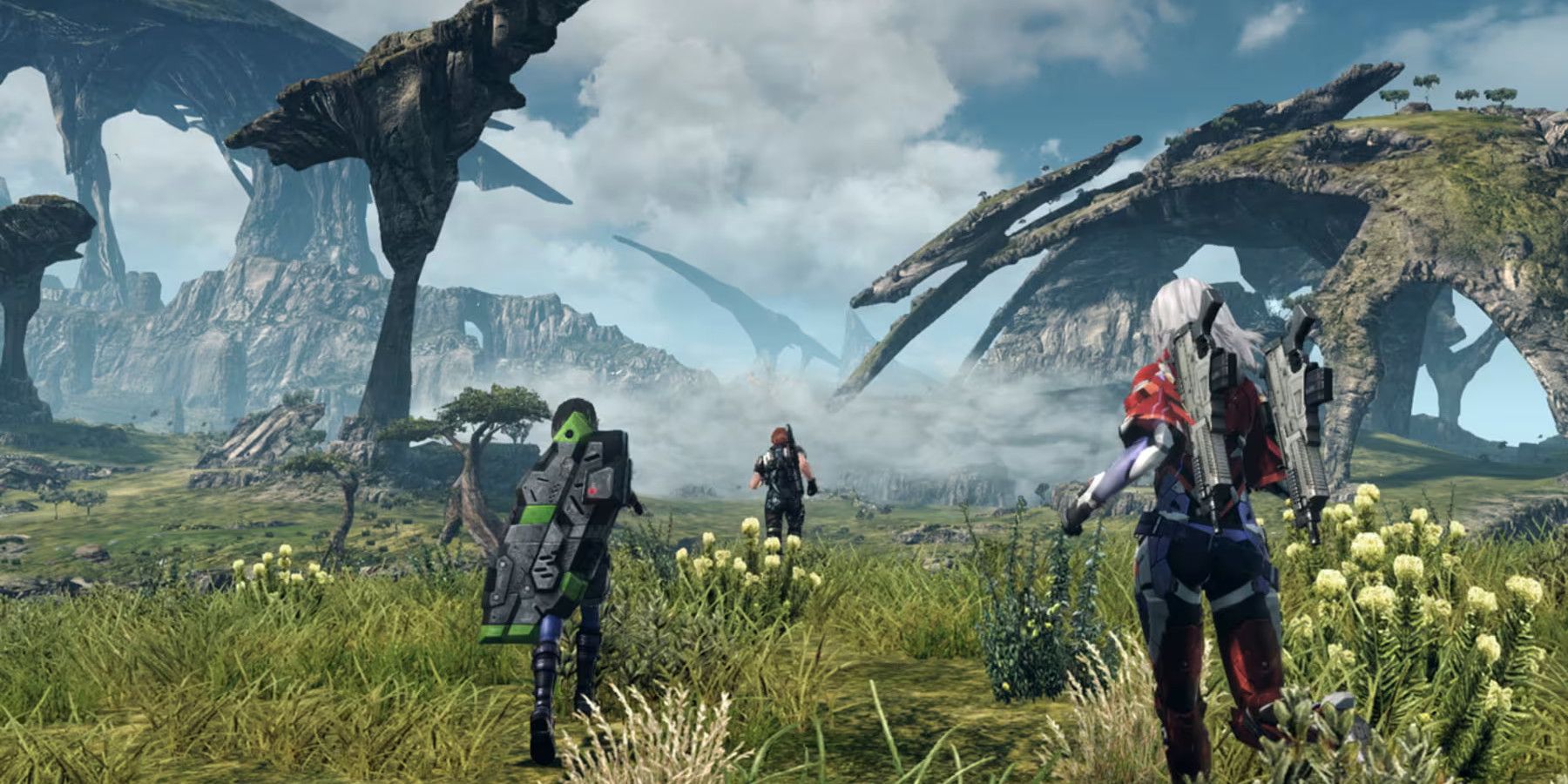 Tres personajes en un campo de hierba en Xenoblade Chronicles X.